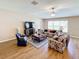 Spacious living room with comfortable seating and large windows at 13336 Great Plains Dr, Riverview, FL 33579