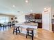 Modern kitchen with granite countertops, stainless steel appliances, and an island at 13336 Great Plains Dr, Riverview, FL 33579