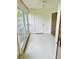 Spacious lanai with sliding glass doors and view of backyard at 1655 S Highland Ave # F133, Clearwater, FL 33756
