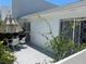 Private patio with table, chairs, and umbrella at 1655 S Highland Ave # F133, Clearwater, FL 33756