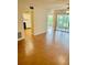 Open concept living room and kitchen with laminate wood flooring at 1655 S Highland Ave # F133, Clearwater, FL 33756