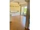 Bright dining area with wood-look floors and sliding glass doors at 1655 S Highland Ave # F133, Clearwater, FL 33756