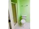 Clean bathroom with shower, toilet and light green walls at 1655 S Highland Ave # F133, Clearwater, FL 33756