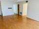 Spacious living area with laminate flooring and access to other rooms at 1655 S Highland Ave # F133, Clearwater, FL 33756