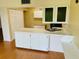Kitchen features white cabinets, a double sink, and ample counter space at 1655 S Highland Ave # F133, Clearwater, FL 33756