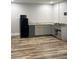 Modern kitchen with gray cabinets, granite countertops, and new appliances at 2226 S Kings Ave, Brandon, FL 33511