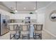 Modern kitchen with white cabinets, granite countertops and stainless steel appliances at 7961 Lakes Edge Ln, Port Charlotte, FL 33981