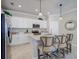 Modern kitchen with white cabinets, granite countertops and stainless steel appliances at 7961 Lakes Edge Ln, Port Charlotte, FL 33981