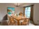 Farmhouse style dining room with a large wooden table at 2908 Woods End Ct, Tampa, FL 33618