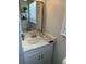 Clean bathroom with white vanity, quartz countertop, and gold fixtures at 608 N Macdill Ave, Tampa, FL 33609