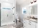Spa-like bathroom with walk-in shower and window for natural light at 18390 Fremont Ave, Port Charlotte, FL 33954