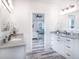 Double vanity bathroom with granite countertop and large mirror at 18390 Fremont Ave, Port Charlotte, FL 33954