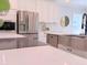 Stainless steel appliances and farmhouse sink in a bright kitchen at 18390 Fremont Ave, Port Charlotte, FL 33954