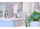 White kitchen with stainless steel appliances and large island at 18390 Fremont Ave, Port Charlotte, FL 33954