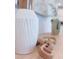 Close-up of kitchen countertop with decorative vase and wooden object at 18390 Fremont Ave, Port Charlotte, FL 33954