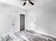Spacious bedroom featuring wood-look floors and ample closet space at 18390 Fremont Ave, Port Charlotte, FL 33954