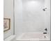 Bright bathroom with white tiled shower and bathtub at 18390 Fremont Ave, Port Charlotte, FL 33954