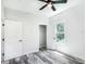 Well-lit bedroom, complete with wood-look floors and a closet at 18390 Fremont Ave, Port Charlotte, FL 33954