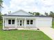 Charming one-story home with front porch and attached garage at 18390 Fremont Ave, Port Charlotte, FL 33954