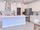 Modern kitchen featuring white cabinets, stainless steel appliances, and an island at 18390 Fremont Ave, Port Charlotte, FL 33954