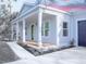 House exterior showcasing a front porch and gray siding at 18390 Fremont Ave, Port Charlotte, FL 33954