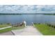 Peaceful lake access with wooden dock at 11405 Emerald Shore Dr, Riverview, FL 33579