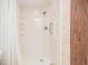 Walk-in shower with built-in seat and grab bar at 3332 Scorecard Dr, New Port Richey, FL 34655