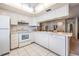View of kitchen with white cabinets and appliances at 3332 Scorecard Dr, New Port Richey, FL 34655