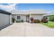 Light gray condo building with a private entrance and landscaping at 3332 Scorecard Dr, New Port Richey, FL 34655