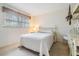 Bright bedroom with a queen-size bed and built-in desk at 3332 Scorecard Dr, New Port Richey, FL 34655