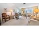 Living room with comfy seating, a coffee table, and lamps at 3332 Scorecard Dr, New Port Richey, FL 34655