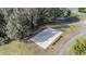 Outdoor sand volleyball court with benches at 3332 Scorecard Dr, New Port Richey, FL 34655
