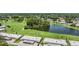 Aerial view of homes near a lake and golf course at 3332 Scorecard Dr, New Port Richey, FL 34655