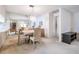 Bright dining area with table and chairs, views into living room and kitchen at 3332 Scorecard Dr, New Port Richey, FL 34655