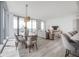 Open concept living and dining area with modern furniture and hardwood floors at 5120 Marina Way # 8805, Tampa, FL 33611