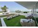 Luxury condo with a spacious patio featuring comfy seating and a putting green at 5120 Marina Way # 8805, Tampa, FL 33611