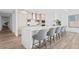 Modern kitchen with light cabinets and a large island with seating at 5120 Marina Way # 8805, Tampa, FL 33611