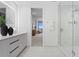 Modern bathroom with a glass shower, double vanity, and city view at 5120 Marina Way # 8805, Tampa, FL 33611