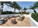 Relaxing rooftop deck with wicker furniture and tropical landscaping at 5120 Marina Way # 8805, Tampa, FL 33611