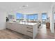 Modern kitchen with sleek cabinetry and a large island, open to the living area at 5120 Marina Way # 8805, Tampa, FL 33611
