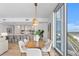 Modern dining area with wood table and kitchen views at 5120 Marina Way # 8805, Tampa, FL 33611