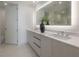 Elegant bathroom with a double vanity and large mirror at 5120 Marina Way # 8805, Tampa, FL 33611
