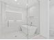Spa-like bathroom with a soaking tub, glass shower, and modern fixtures at 5120 Marina Way # 8805, Tampa, FL 33611