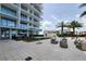Upscale condo building with a bocce ball court and comfortable seating areas on the patio at 5120 Marina Way # 8805, Tampa, FL 33611