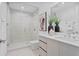 Modern bathroom with glass shower and double vanity at 5120 Marina Way # 8805, Tampa, FL 33611