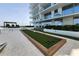Modern condo building with a well-maintained bocce ball court at 5120 Marina Way # 8805, Tampa, FL 33611
