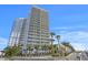 Modern high-rise building with waterfront access and lush landscaping at 5120 Marina Way # 8805, Tampa, FL 33611