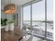 Bright dining room with hardwood floors, modern light fixture and city views at 5120 Marina Way # 8805, Tampa, FL 33611