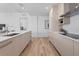 Modern kitchen with light wood cabinets and quartz countertops at 5120 Marina Way # 8805, Tampa, FL 33611