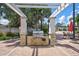 Outdoor grilling station with stone facade and pergola at 10906 Holly Cone Dr, Riverview, FL 33569